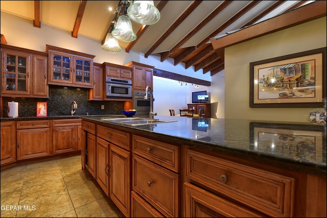 5401 Tierra Vista Dr, El Paso, TX 79932 - kitchen featuring decorative backsplash, oven, glass insert cabinets, and a sink