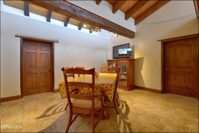 5401 Tierra Vista Dr, El Paso, TX 79932 - dining room featuring baseboards, light tile patterned flooring, and rail lighting