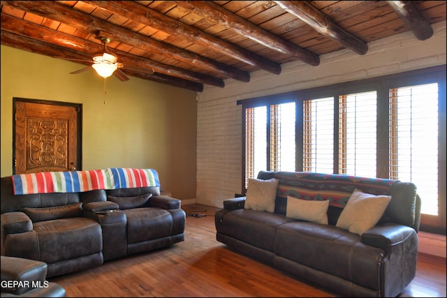 5401 Tierra Vista Dr, El Paso, TX 79932 - living area with wooden ceiling with exposed beams, plenty of natural light, ceiling fan, wood finished floors, and brick wall
