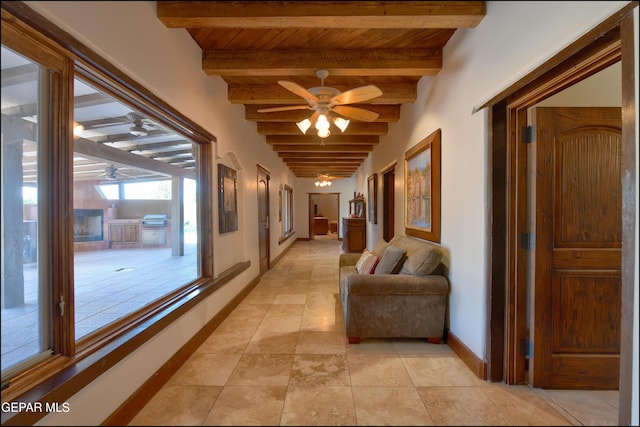 5401 Tierra Vista Dr, El Paso, TX 79932 - hallway with wooden ceiling with exposed beams, baseboards, and light tile patterned floors