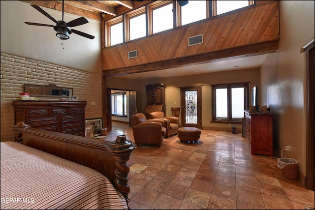 5401 Tierra Vista Dr, El Paso, TX 79932 - bedroom featuring a high ceiling, beamed ceiling, stone tile floors, multiple windows, and recessed lighting