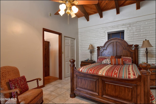 5401 Tierra Vista Dr, El Paso, TX 79932 - bedroom featuring wood ceiling with exposed beams, light tile patterned flooring, and a ceiling fan