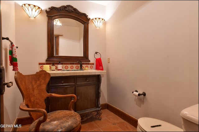 5401 Tierra Vista Dr, El Paso, TX 79932 - half bath featuring toilet, baseboards, tile patterned flooring, and vanity