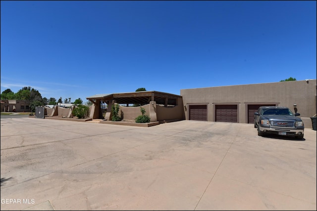 5401 Tierra Vista Dr, El Paso, TX 79932 - adobe home with stucco siding and a garage