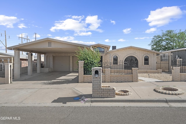 4808 Sagittarius Ave, El Paso, TX 79924 - view of front of property featuring a fenced front yard, a gate, brick siding, concrete driveway, and an attached garage