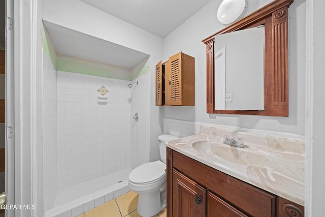 4808 Sagittarius Ave, El Paso, TX 79924 - full bathroom featuring vanity, tile patterned floors, a tile shower, and toilet