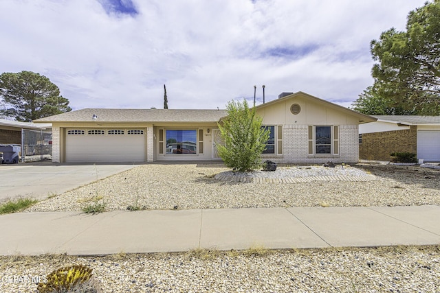 11016 Bob Stone Dr, El Paso, TX 79936 - ranch-style house featuring brick siding, a garage, concrete driveway, and board and batten siding