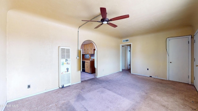 6001 Canton Ct, El Paso, TX 79905 - unfurnished room featuring a ceiling fan, visible vents, carpet floors, baseboards, and a heating unit
