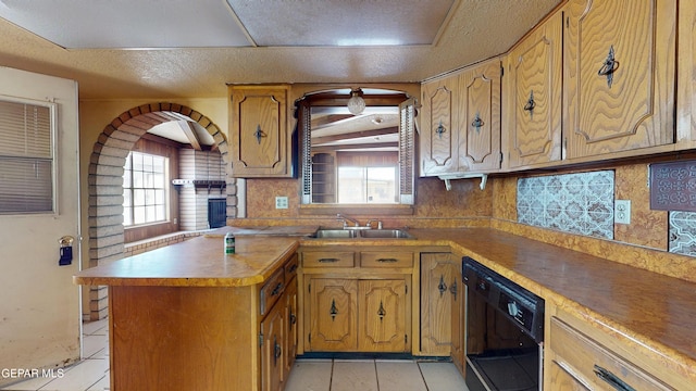 6001 Canton Ct, El Paso, TX 79905 - kitchen with a sink, plenty of natural light, light tile patterned floors, and dishwasher