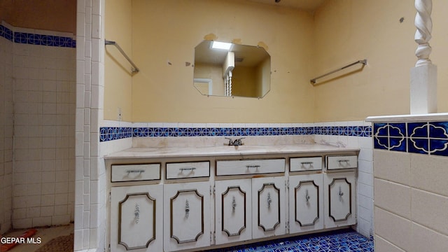 6001 Canton Ct, El Paso, TX 79905 - bathroom featuring wainscoting, tile walls, and vanity