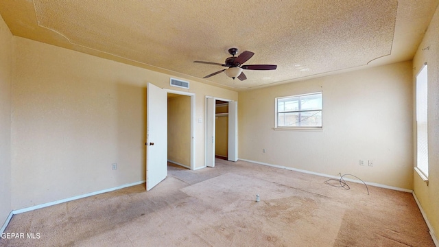 6001 Canton Ct, El Paso, TX 79905 - unfurnished bedroom featuring visible vents, carpet flooring, a textured ceiling, and multiple windows