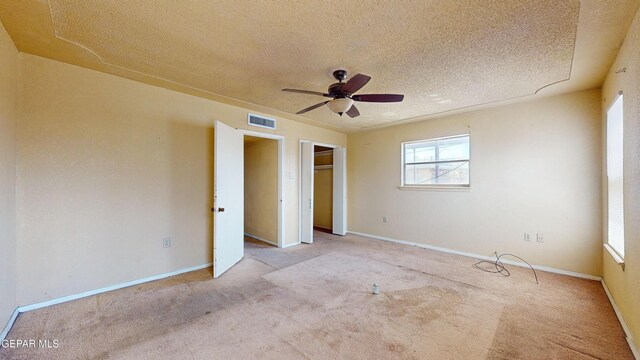6001 Canton Ct, El Paso, TX 79905 - unfurnished bedroom featuring visible vents, carpet flooring, a textured ceiling, and multiple windows