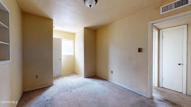 6001 Canton Ct, El Paso, TX 79905 - carpeted spare room featuring baseboards and visible vents