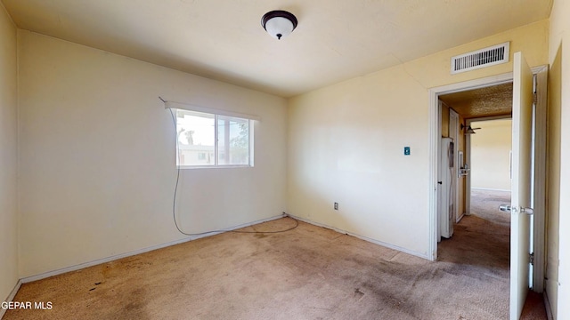 6001 Canton Ct, El Paso, TX 79905 - unfurnished bedroom with carpet floors, baseboards, and visible vents