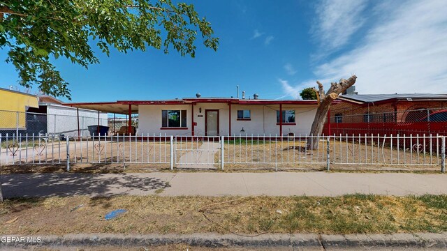 6001 Canton Ct, El Paso, TX 79905 - ranch-style house featuring a carport, a fenced front yard, and stucco siding