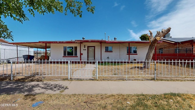 6001 Canton Ct, El Paso, TX 79905 - view of front of home with a fenced front yard and stucco siding