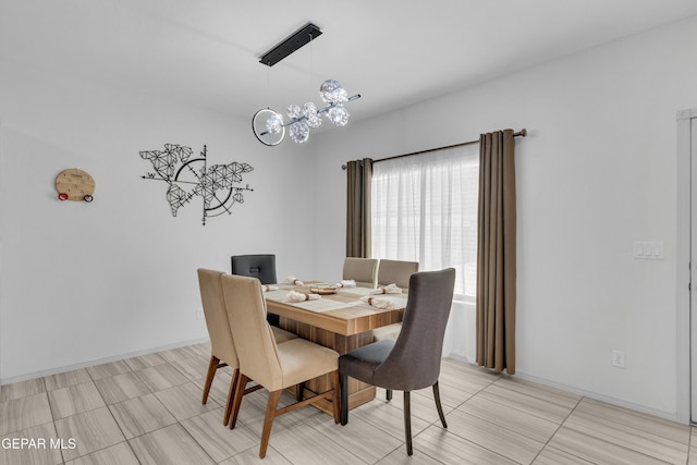 dining space featuring a chandelier