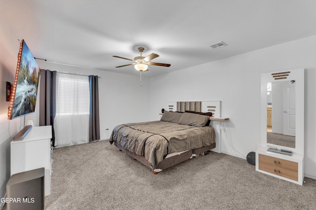 bedroom featuring carpet floors, ceiling fan, and visible vents