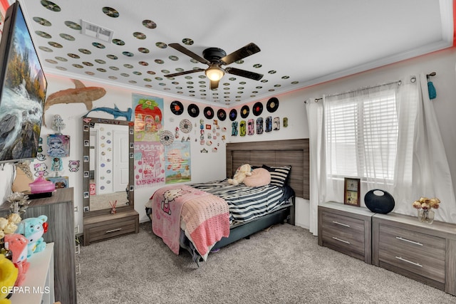 bedroom with visible vents, ornamental molding, and light carpet