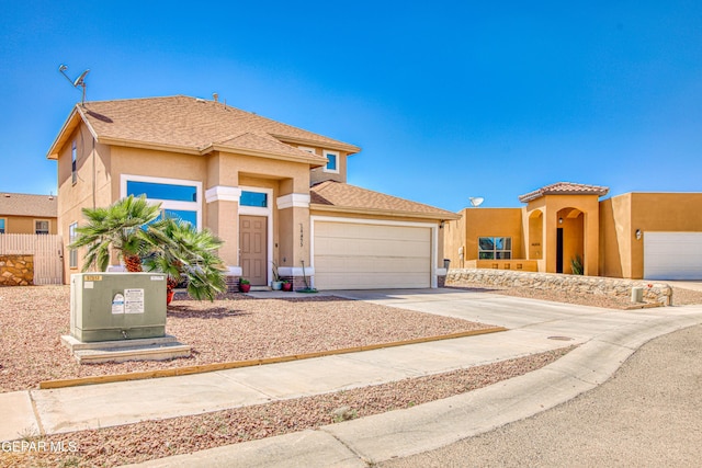 14253 Hacienda Rock Dr, El Paso, TX 79938 - view of front of property with an attached garage, stucco siding, and concrete driveway