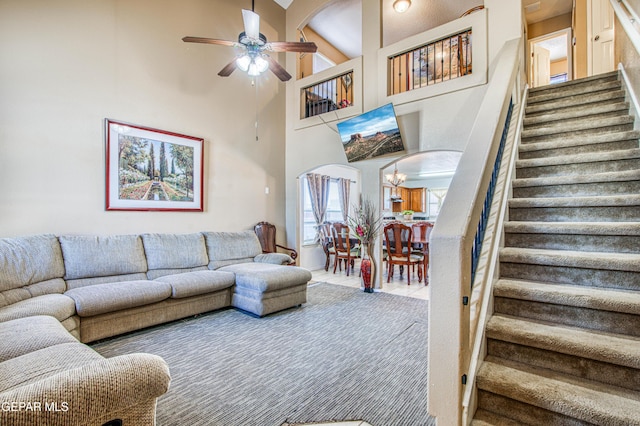 14253 Hacienda Rock Dr, El Paso, TX 79938 - living room featuring stairs, a ceiling fan, and high vaulted ceiling