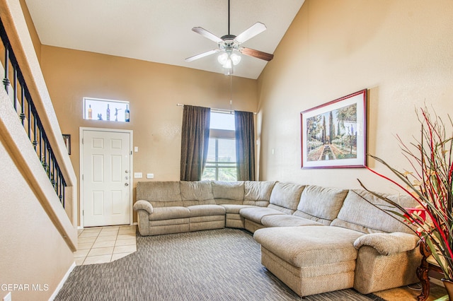 14253 Hacienda Rock Dr, El Paso, TX 79938 - tiled living room with high vaulted ceiling, a ceiling fan, and stairway