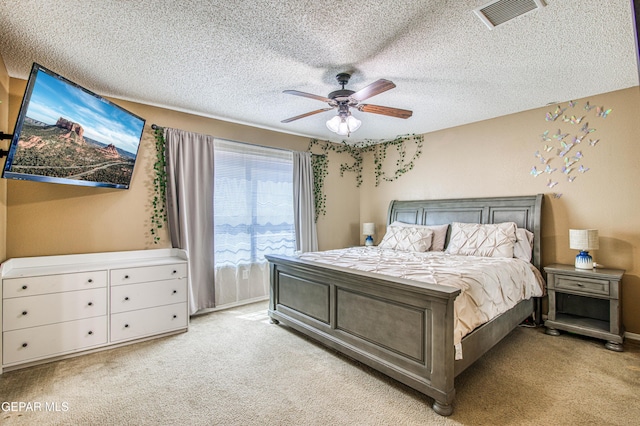 14253 Hacienda Rock Dr, El Paso, TX 79938 - bedroom featuring light colored carpet, a textured ceiling, and ceiling fan
