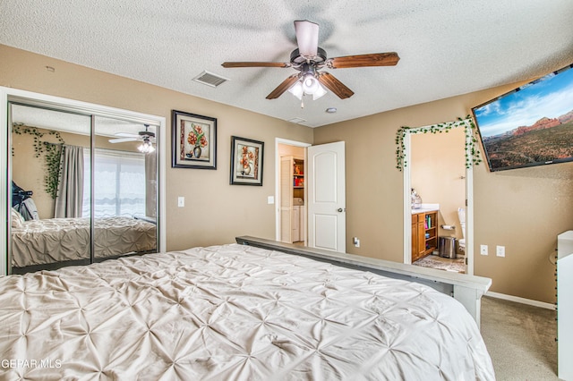 14253 Hacienda Rock Dr, El Paso, TX 79938 - bedroom featuring a textured ceiling, a closet, carpet floors, ceiling fan, and ensuite bath