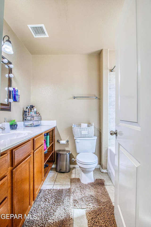 14253 Hacienda Rock Dr, El Paso, TX 79938 - full bath with toilet, vanity, tile patterned flooring, and washtub / shower combination