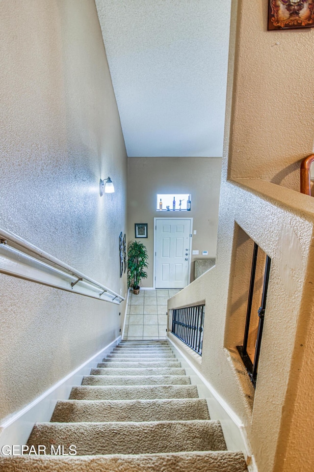 14253 Hacienda Rock Dr, El Paso, TX 79938 - stairs featuring a textured wall and a textured ceiling