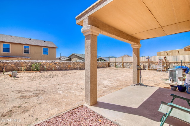 14253 Hacienda Rock Dr, El Paso, TX 79938 - view of patio with a fenced backyard and central air condition unit
