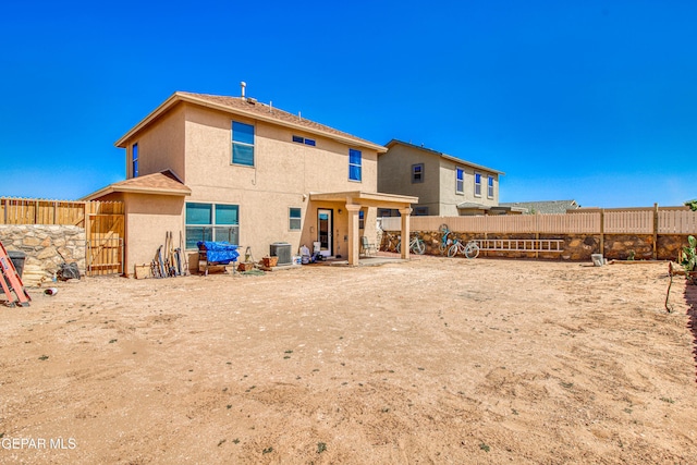 14253 Hacienda Rock Dr, El Paso, TX 79938 - back of house with central air condition unit, fence, and stucco siding