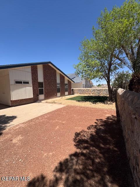 exterior space featuring fence and a patio area