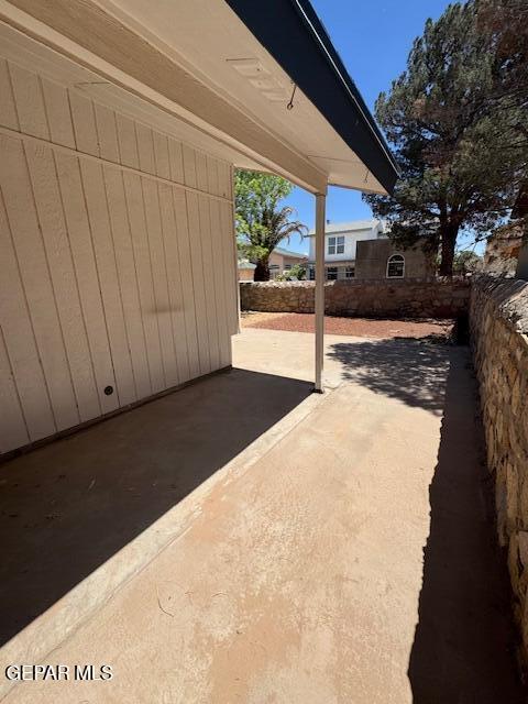 view of patio / terrace featuring fence