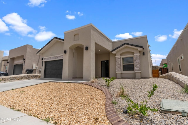 13106 Salterton Ave, El Paso, TX 79928 - view of front of property with fence, a garage, driveway, and stucco siding
