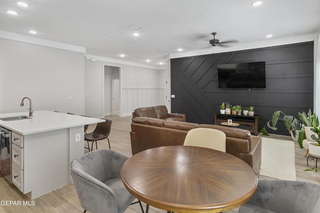 13106 Salterton Ave, El Paso, TX 79928 - dining room featuring light wood-type flooring, recessed lighting, ceiling fan, and a decorative wall