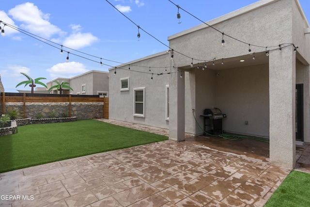 13106 Salterton Ave, El Paso, TX 79928 - back of house with a patio, a fenced backyard, a lawn, and stucco siding