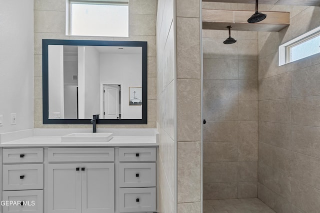 13106 Salterton Ave, El Paso, TX 79928 - bathroom featuring vanity and a tile shower