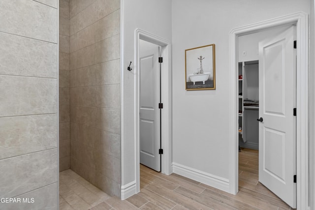 13106 Salterton Ave, El Paso, TX 79928 - bathroom with wood finish floors, tiled shower, and baseboards