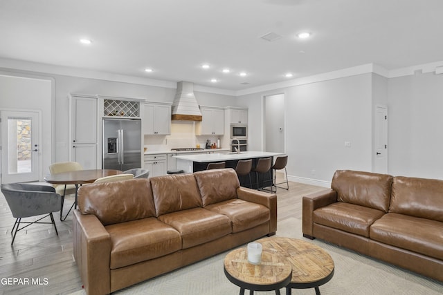 13106 Salterton Ave, El Paso, TX 79928 - living area with crown molding, recessed lighting, baseboards, and light wood-type flooring