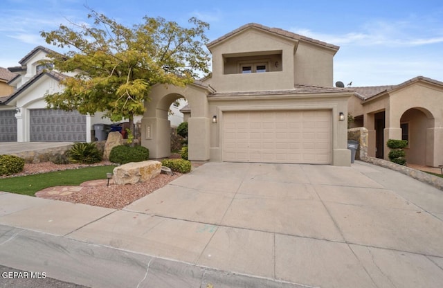 12164 Sitting Bull Dr, El Paso, TX 79936 - view of front facade with stucco siding, concrete driveway, an attached garage, and a tile roof