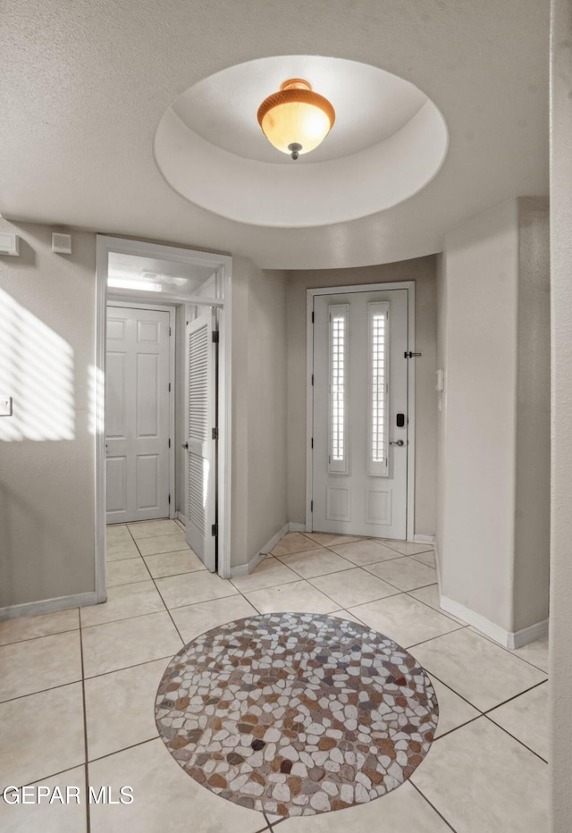 12164 Sitting Bull Dr, El Paso, TX 79936 - foyer entrance with baseboards and light tile patterned floors