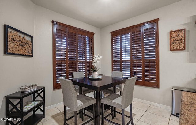 12164 Sitting Bull Dr, El Paso, TX 79936 - dining space featuring light tile patterned floors and baseboards