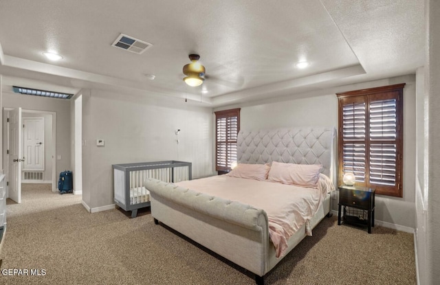 12164 Sitting Bull Dr, El Paso, TX 79936 - carpeted bedroom with a tray ceiling, baseboards, ceiling fan, and recessed lighting