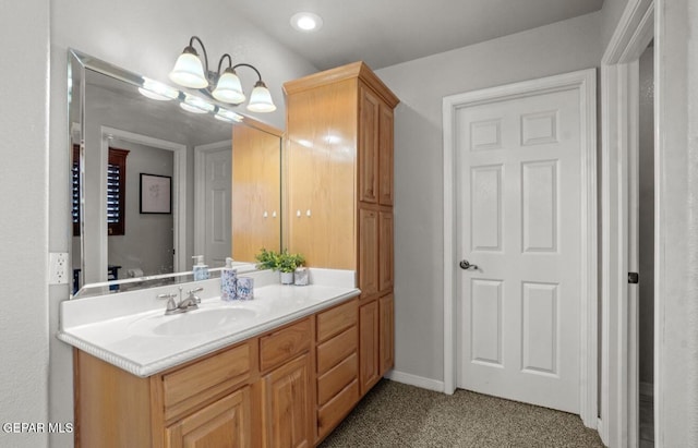 12164 Sitting Bull Dr, El Paso, TX 79936 - bathroom featuring vanity, recessed lighting, and baseboards