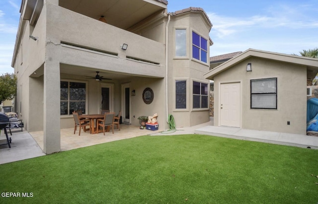 12164 Sitting Bull Dr, El Paso, TX 79936 - back of house with stucco siding, a lawn, a patio, and ceiling fan