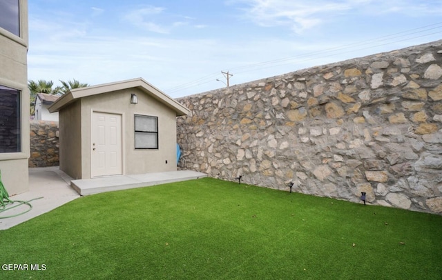 12164 Sitting Bull Dr, El Paso, TX 79936 - view of grassy yard with an outbuilding
