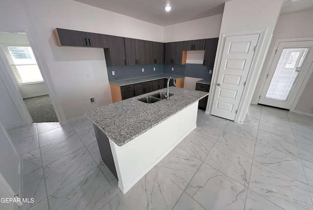 913 Larkhall Pl, El Paso, TX 79928 - kitchen with baseboards, a sink, and marble finish floor
