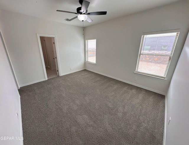 913 Larkhall Pl, El Paso, TX 79928 - spare room featuring a ceiling fan, baseboards, visible vents, and dark carpet