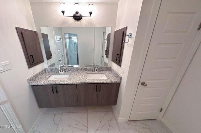 913 Larkhall Pl, El Paso, TX 79928 - full bath with double vanity, baseboards, a sink, and marble finish floor